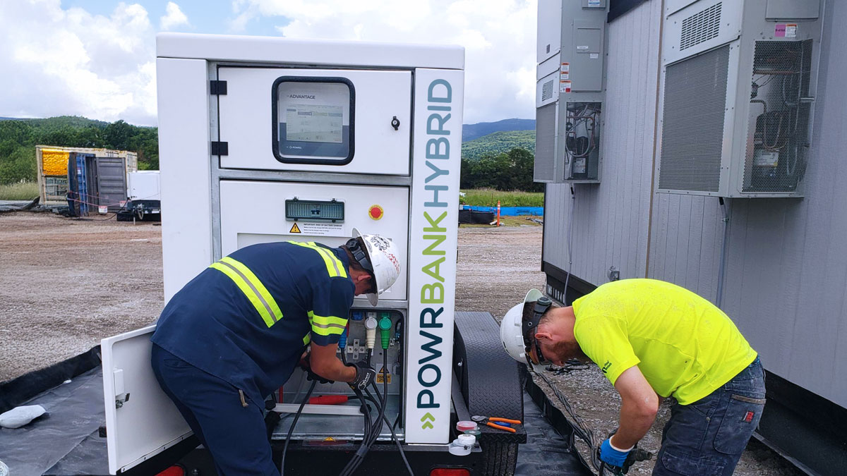 Technicians setting up the POWRBANK HYBRID - Hybrid Power, BESS + Generator on site