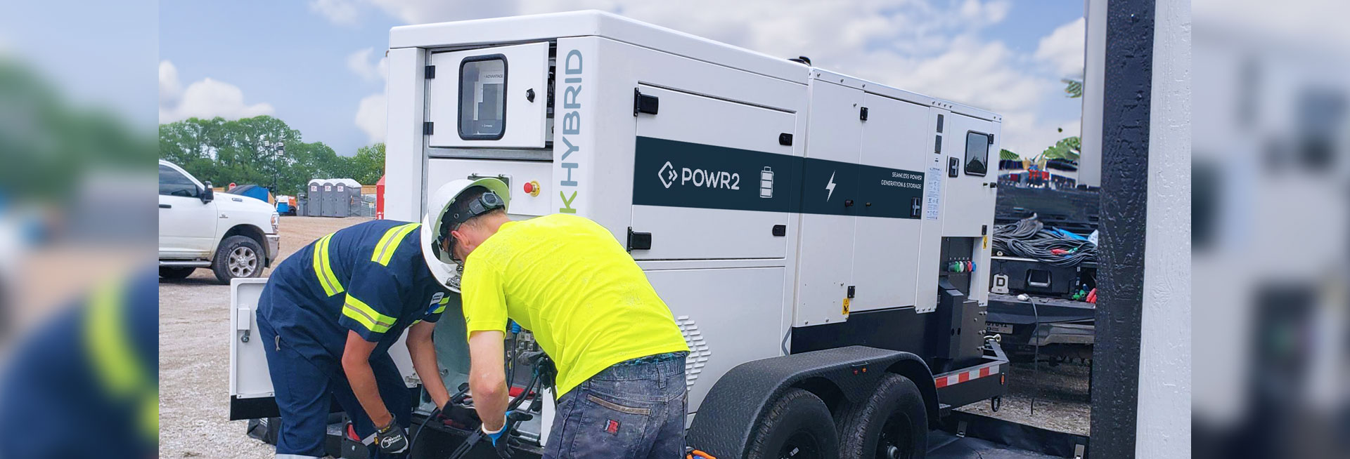 technicians setting up the POWRBANK HYBRID - Hybrid Power, BESS + Generator on site