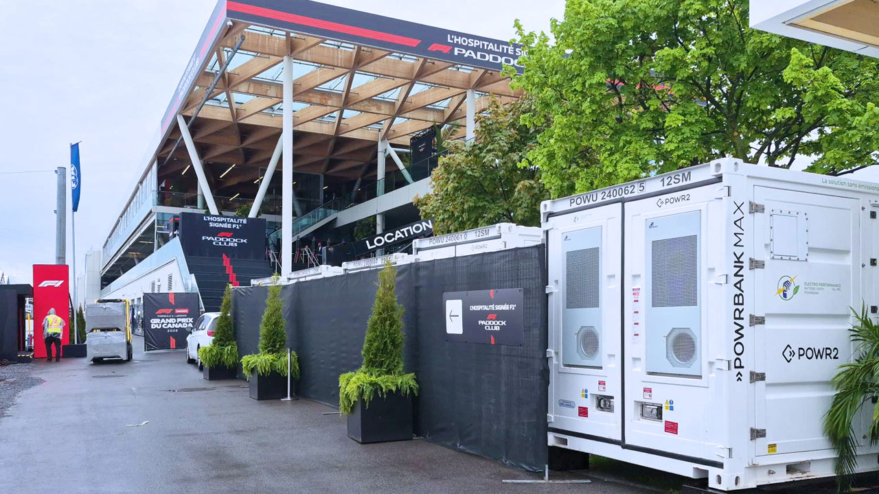 Five POWR2 POWRBANK MAX battery energy storage units staged outside the F1 Paddock Club hospitality building at the 2026 Canadian Grand Prix in Montreal.